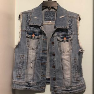 Distressed denim vest